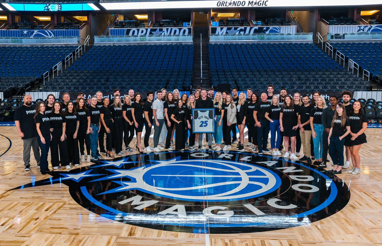 Ken Pozek and team in Orlando Magic arena